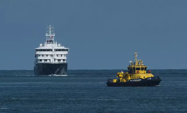 The MV Hondius cruise ship arrives at the Port of Rotterdam, Netherlands, Monday, May 18, 2026. (AP Photo/Patrick Post)