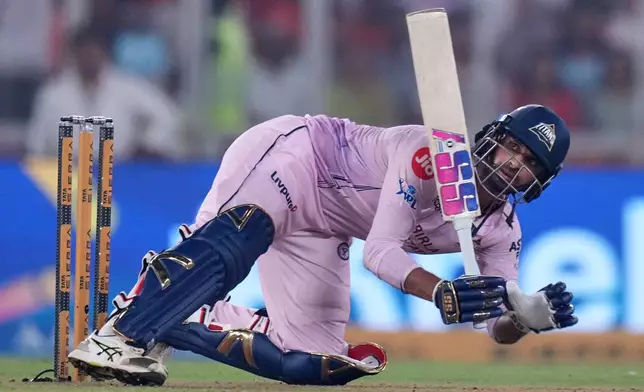 Gujarat Titans' Washington Sundar plays a shot during the Indian Premier League cricket match between Gujarat Titans and Sunrisers Hyderabad, in Ahmedabad, India, Tuesday, May 12, 2026. (AP Photo/Ajit Solanki)