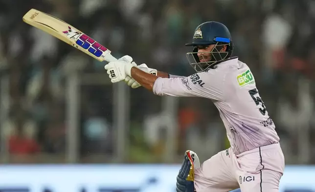 Gujarat Titans' Washington Sundar plays a shot during the Indian Premier League cricket match between Gujarat Titans and Sunrisers Hyderabad, in Ahmedabad, India, Tuesday, May 12, 2026. (AP Photo/Ajit Solanki)