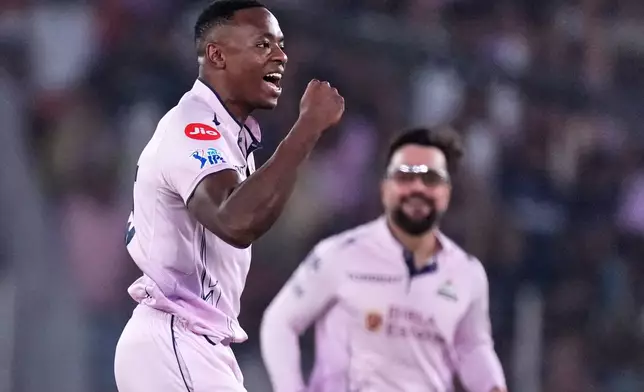 Gujarat Titans' Kagiso Rabada celebrates the wicket of Sunrisers Hyderabad's Abhishek Sharma during the Indian Premier League cricket match between Gujarat Titans and Sunrisers Hyderabad, in Ahmedabad, India, Tuesday, May 12, 2026. (AP Photo/Ajit Solanki)