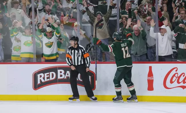 Minnesota Wild left wing Matt Boldy (12) celebrates after scoring during the third period of Game 6 in the first round of the NHL hockey Stanley Cup playoff series against the Dallas Stars, Thursday, April 30, 2026, in St. Paul, Minn. (AP Photo/Bailey Hillesheim)