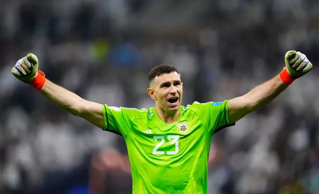 FILE - Argentina's goalkeeper Emiliano Martinez celebrates after he saved a penalty kick during the penalty shootouts in the World Cup final soccer match between Argentina and France at the Lusail Stadium in Lusail, Qatar, Sunday, Dec. 18, 2022. (AP Photo/Petr David Josek File)