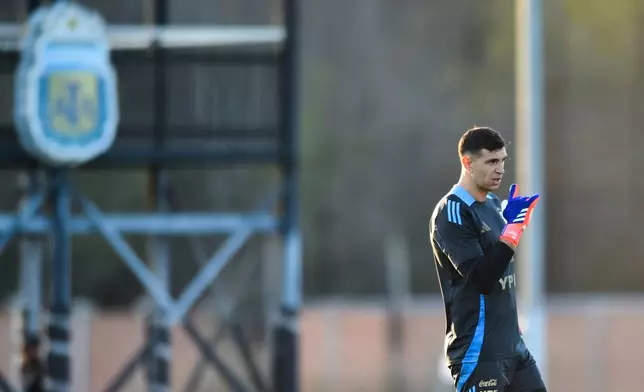 FILE - Argentina's Emiliano Martinez looks on during a training session for an upcoming World Cup qualifying soccer match against Chile, Tuesday, Sept. 3, 2024, in Buenos Aires, Argentina. (AP Photo/Gustavo Garello, File)