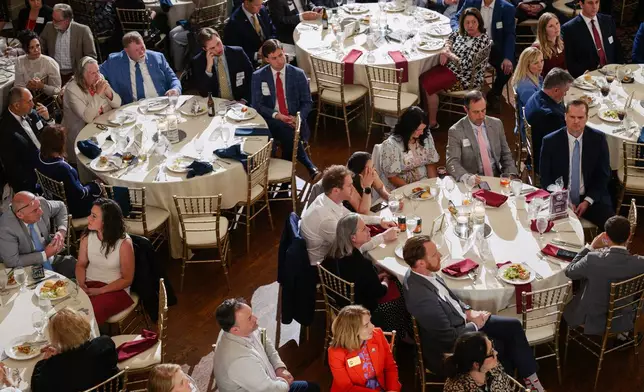 Guests look on as candidates speak on stage during the Kenton County Republican Party Lincoln Day Dinner, Thursday, April 30, 2026, in Covington, Ky. (AP Photo/Jon Cherry)