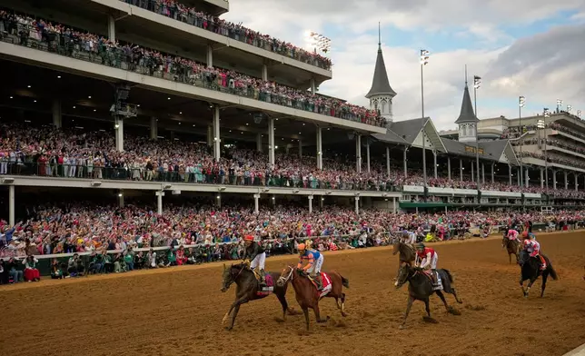 Golden Tempo, left, ridden by Jose L. Ortiz wins the 152nd running of the Kentucky Derby horse race at Churchill Downs, Saturday, May 2, 2026, in Louisville, Ky. (AP Photo/Abbie Parr)
