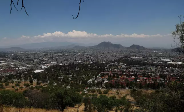 FILE - A view of Mexico City as seen from the Iztapalapa neighborhood, April 30, 2020. (AP Photo/Marco Ugarte, File)