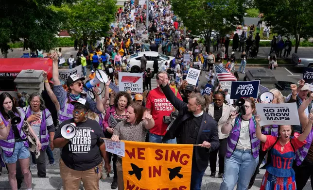Protesters march to the Capitol before a special session of the state legislature to redraw U.S. Congressional voting maps in Nashville, Tenn., Tuesday, May 5, 2026. (AP Photo/George Walker IV)