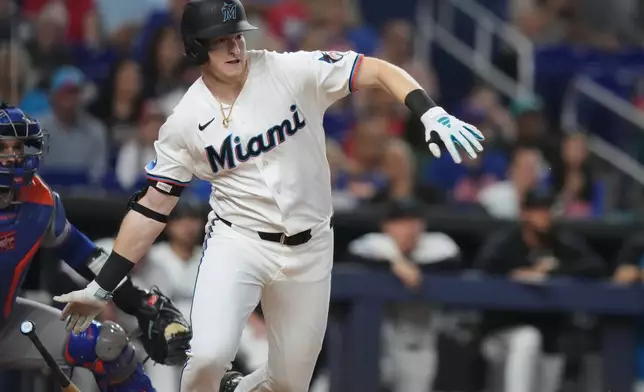 Miami Marlins' Owen Caissie runs after hitting a RBI double to score two runs during the second inning of a baseball game against the New York Mets, Saturday, May 23, 2026, in Miami. (AP Photo/Lynne Sladky)