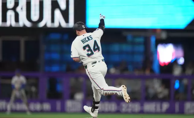 Miami Marlins' Liam Hicks (34) runs the bases after hitting a solo home run during the third inning of a baseball game against the New York Mets, Saturday, May 23, 2026, in Miami. (AP Photo/Lynne Sladky)
