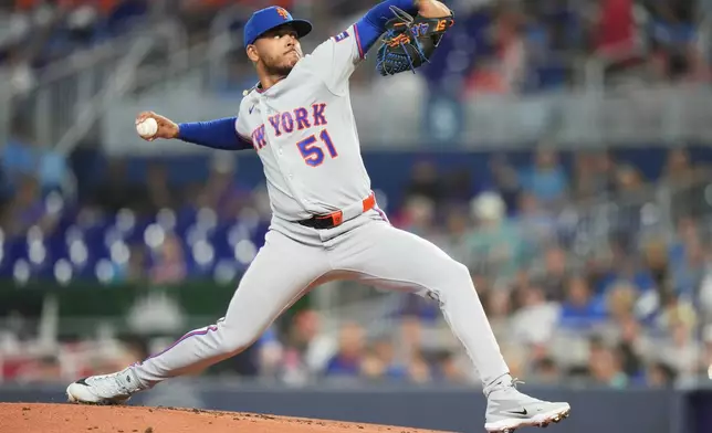 New York Mets starting pitcher Freddy Peralta throws during the first inning of a baseball game against the Miami Marlins, Saturday, May 23, 2026, in Miami. (AP Photo/Lynne Sladky)
