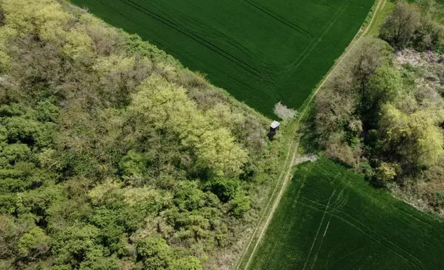 A small forest dubbed the Nightingale's Forest is seen near the village of Plandiste, in the flat, farming region of Serbia, Thursday, April 16, 2026. (AP Photo/Darko Vojinovic)