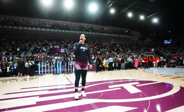 Toronto Tempo's Kia Nurse, foreground, speaks to the home crowd prior to WNBA basketball game action against the Washington Mystics in Toronto, Friday, May 8, 2026. (Nathan Denette/The Canadian Press via AP)