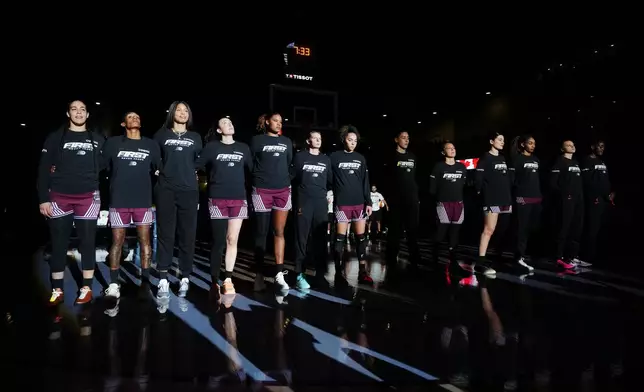 Toronto Tempo's Kia Nurse, left, and teammates stand for "O Canada" prior to WNBA basketball game action against the Washington Mystics in Toronto, Friday, May 8, 2026. (Nathan Denette/The Canadian Press via AP)