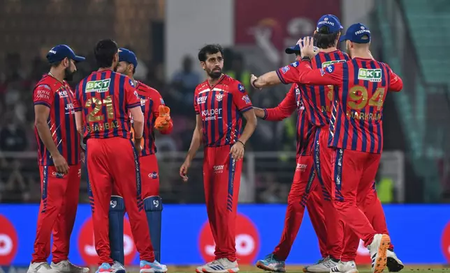 Lucknow Super Giants' Prince Yadav, center without cap, celebrates with teammates the wicket of Royal Challengers Bengaluru's Devdutt Padikkal during the Indian Premier League cricket match between Royal Challengers Bengaluru and Lucknow Super Giants in Lucknow, India, Thursday, May 7, 2026. (AP Photo)