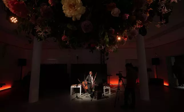 Musician Alexey Khovalyg performs inside the Russia pavilion at the Venice 2026 Biennale Art, Italy, Tuesday, May 5, 2026. (AP Photo/Luca Bruno)