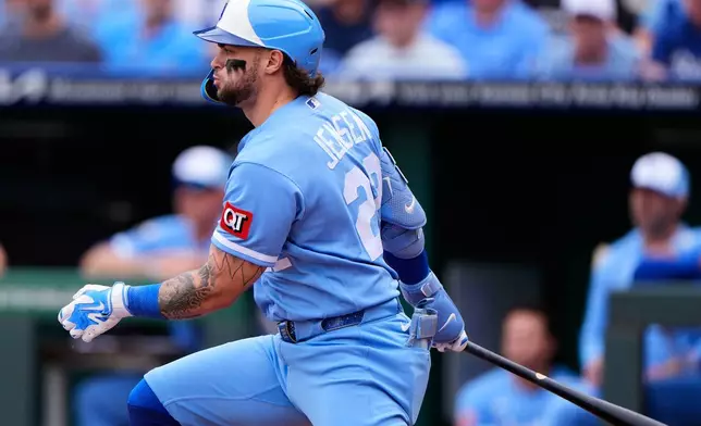 Kansas City Royals' Carter Jensen watches his RBI single during the first inning of a baseball game against the Seattle Mariners, Saturday, May 23, 2026, in Kansas City, Mo. (AP Photo/Charlie Riedel)