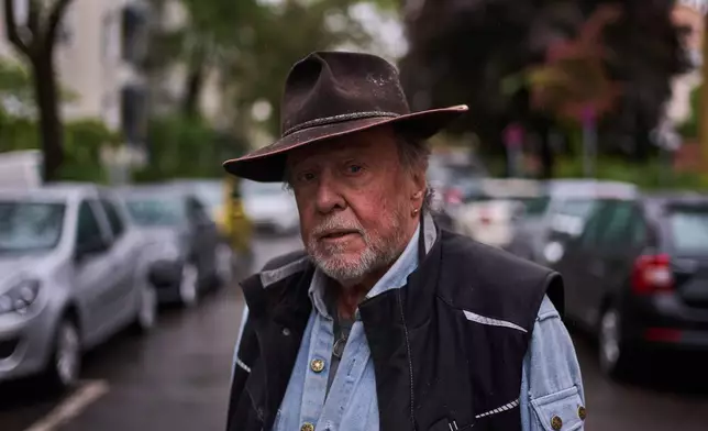 Artist Gunter Demnig poses for a portrait prior of a ceremony placing palm-sized brass Holocaust plaques called "Stolpersteine", or "Stumbling Blocks" with the names of victims of the Nazi regime in front of their former home, in Berlin, Germany, Wednesday, May 6, 2026. (AP Photo/Markus Schreiber)