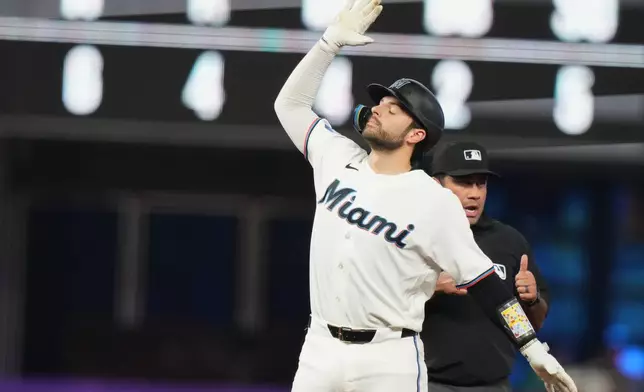 Miami Marlins' Joe Mack reacts after hitting a double during the fifth inning of a baseball game against the Washington Nationals, Saturday, May 9, 2026, in Miami. (AP Photo/Lynne Sladky)
