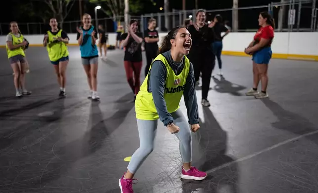 Grace Curatolo celebrates after making a shot during a handball practice session in Tustin, Calif., Wednesday, March 25, 2026. (AP Photo/Jae C. Hong)