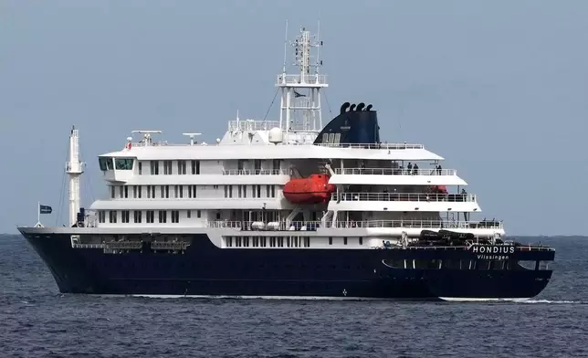 The MV Hondius cruise ship departs the port in Praia, Cape Verde, Wednesday, May 6, 2026. (AP Photo/Misper Apawu)
