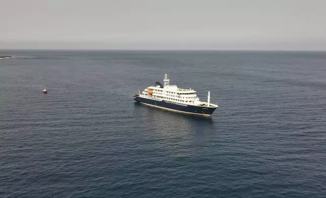An aerial view of the MV Hondius Dutch cruise ship anchored in the Atlantic off Cape Verde, Tuesday, May 5, 2026. (AP Photo/Arilson Almeida)