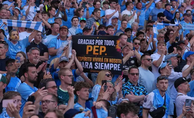 Manchester City fans holds a sign thanking the coach Pep Guardiola during his last macth as a manager during a Premier League soccer match between Manchester City and Aston Villa in Manchester, England, Sunday, May 24, 2026. (AP Photo/Alastair Grant)