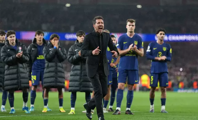 Atletico Madrid's head coach Diego Simeone and the players applaud the supporters at the the end of a Champions League semifinal, second leg, soccer match between Arsenal FC and Atletico Madrid in London, Tuesday, May 5, 2026. (AP Photo/Alastair Grant)