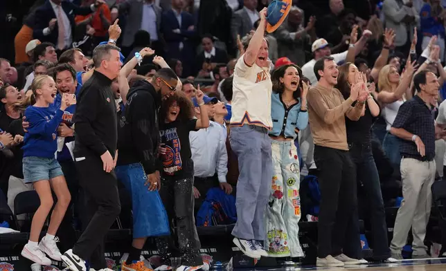 New York Knicks fans react during the second half of Game 1 in the Eastern Conference finals NBA basketball playoffs series against the Cleveland Cavaliers, Tuesday, May 19, 2026, in New York. (AP Photo/Seth Wenig)