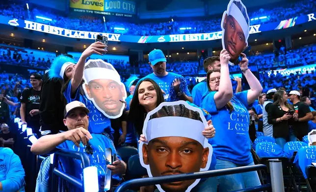 Fans cheer before Game 1 in a third-round NBA basketball playoffs series between the San Antonio Spurs and the Oklahoma City Thunder Monday, May 18, 2026, in Oklahoma City. (AP Photo/Tony Gutierrez)