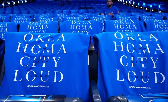 T-shirts are draped on fan seats before Game 1 in a third-round NBA basketball playoffs series between the San Antonio Spurs and the Oklahoma City Thunder Monday, May 18, 2026, in Oklahoma City. (AP Photo/Tony Gutierrez)