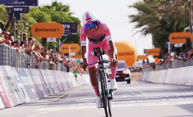 Portugal's Afonso Oliveira Eulalio crosses the finish line to complete the 10th stage of the Giro d'Italia cycling race from Viareggio to Massa, Italy, Tuesday May 19, 2026. (Gian Mattia D'Alberto/LaPresse via AP)