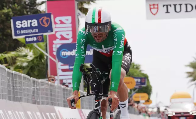 Italy's Filippo Ganna pedals during the 10th stage of the Giro d'Italia cycling race from Viareggio to Massa, Italy, Tuesday May 19, 2026. (Marco Alpozzi/LaPresse via AP)