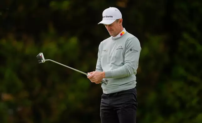 Justin Rose, of England, lines up his putt on the 12th green during the second round of the PGA Championship golf tournament at Aronimink Golf Club, Friday, May 15, 2026, in Newtown Square, PA. (AP Photo/Carolyn Kaster)