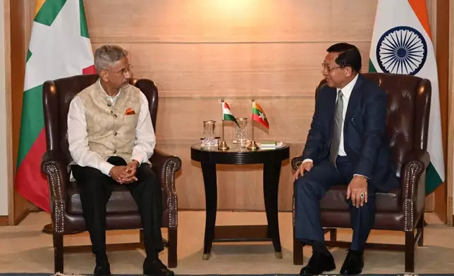 In this photo provided by Myanmar Military True News Information Team on Saturday, May 30, 2026, Myanmar President Min Aung Hlaing, right, talks with Indian External Affairs Minister Subrahmanyam Jaishankar, left, during their meeting in New Deli, India. (Myanmar Military True News Information Team via AP)