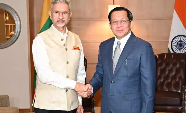 In this photo provided by Myanmar Military True News Information Team on Saturday, May 30, 2026, Myanmar President Min Aung Hlaing, right, shakes hands with Indian External Affairs Minister Subrahmanyam Jaishankar, left, during their meeting in New Deli, India on May 30. (Myanmar Military True News Information Team via AP)