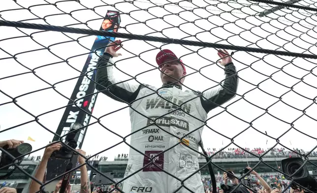 Felix Rosenqvist, of Sweden, celebrates after winning the Indianapolis 500 auto race at Indianapolis Motor Speedway in Indianapolis, Sunday, May 24, 2026. (AP Photo/AJ Mast)