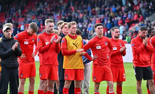 Heidenheim players after the German Bundesliga soccer match between 1. FC Heidenheim and FSV Mainz 05 in Heidenheim, Germany, Saturday, May 16, 2026. (Jan-Philipp Strobel/dpa via AP)