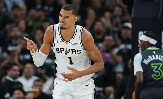 San Antonio Spurs forward Victor Wembanyama (1) reacts to a play during the first half in Game 2 of a second-round NBA playoffs basketball series against the Minnesota Timberwolves in San Antonio, Wednesday, May 6, 2026. (AP Photo/Eric Gay)