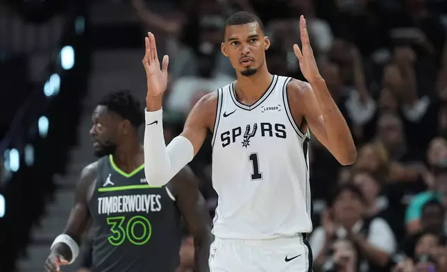 San Antonio Spurs forward Victor Wembanyama (1) reacts to a play during the first half in Game 2 of a second-round NBA playoffs basketball series against the Minnesota Timberwolves in San Antonio, Wednesday, May 6, 2026. (AP Photo/Eric Gay)