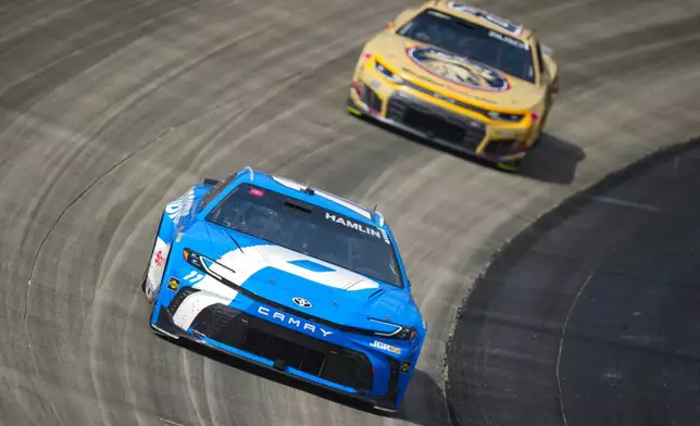 Denny Hamlin (11) drives through Turn 2 during the NASCAR All-Star auto race at Dover Motor Speedway, Sunday, May 17, 2026, in Dover, Del. (AP Photo/Derik Hamilton)