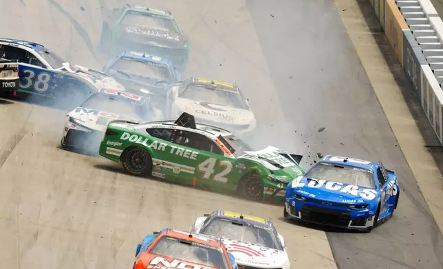 John Hunter Nemechek (42) and Kyle Busch (8) crash on the front stretch during the NASCAR All-Star auto race at Dover Motor Speedway, Sunday, May 17, 2026, in Dover, Del. (AP Photo/Derik Hamilton)