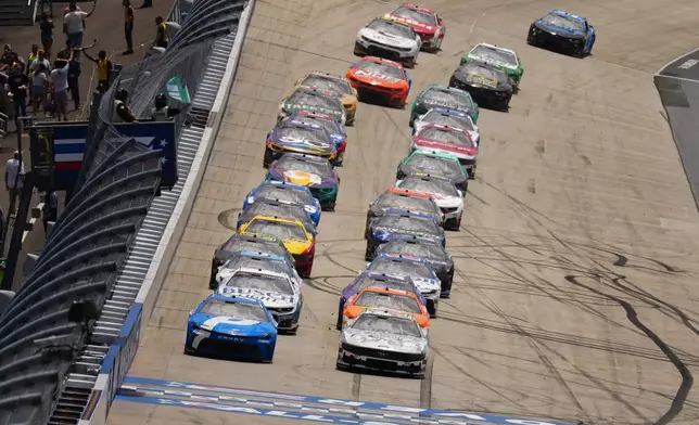 Denny Hamlin (11) and Brad Keselowski (6) lead the field to a restart during the NASCAR All-Star auto race at Dover Motor Speedway, Sunday, May 17, 2026, in Dover, Del. (AP Photo/Derik Hamilton)