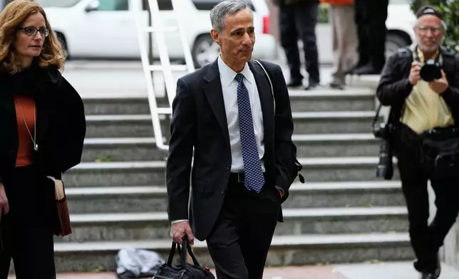 William Savitt, attorney representing OpenAI, right, arrives at the U.S. District Court in Oakland, Calif., Thursday, April 30, 2026. (AP Photo/Godofredo A. Vásquez)