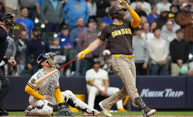 San Diego Padres' Gavin Sheets hits a three-run home run during the ninth inning of a baseball game against the Milwaukee Brewers, Wednesday, May 13, 2026, in Milwaukee. (AP Photo/Aaron Gash)