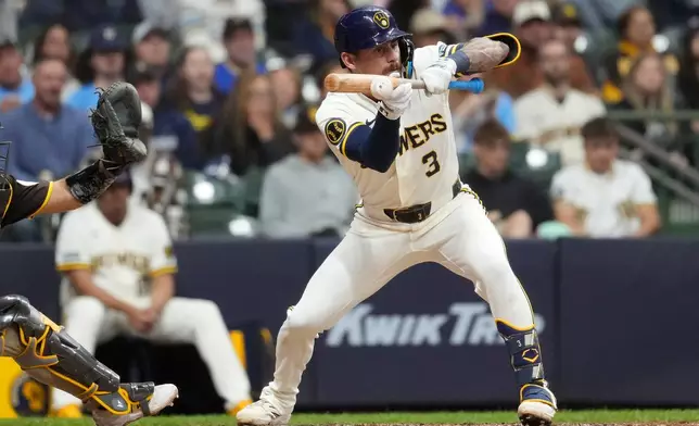 Milwaukee Brewers' Joey Ortiz bunts during the fifth inning of a baseball game against the San Diego Padres, Wednesday, May 13, 2026, in Milwaukee. (AP Photo/Aaron Gash)