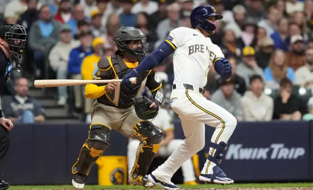 Milwaukee Brewers' Brice Turang hits an RBI fielder's choice groundout during the fifth inning of a baseball game against the San Diego Padres, Wednesday, May 13, 2026, in Milwaukee. (AP Photo/Aaron Gash)