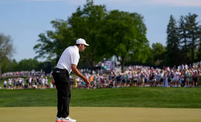 Scottie Scheffler reacts to missing a putt on the 17th green during the third round of the PGA Championship golf tournament at Aronimink Golf Club, Saturday, May 16, 2026, in Newtown Square, PA. (AP Photo/Matt Slocum)