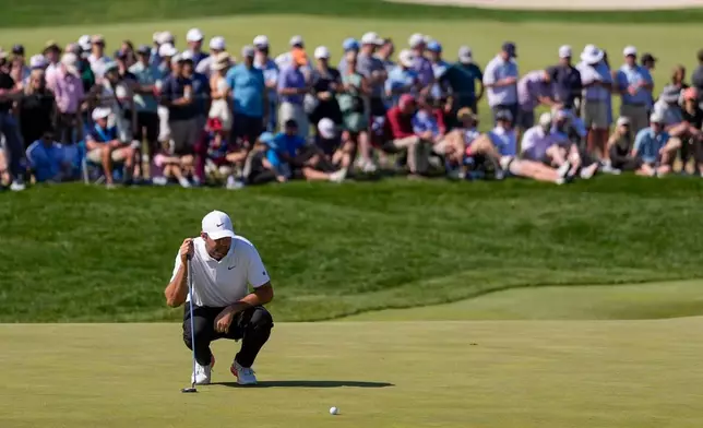 Scottie Scheffler lines up his shot on the 10th green during the third round of the PGA Championship golf tournament at Aronimink Golf Club, Saturday, May 16, 2026, in Newtown Square, PA. (AP Photo/Matt Slocum)