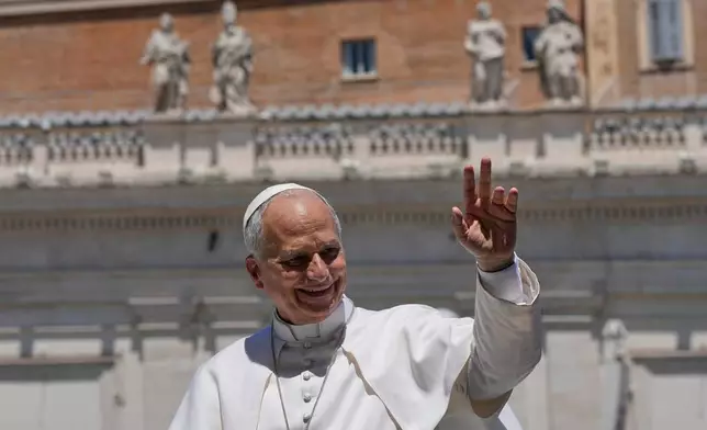 Pope Leo XIV waves as he leaves after his weekly general audience in St. Peter's Square at The Vatican, Wednesday, May 27, 2026. (AP Photo/Alessandra Tarantino)