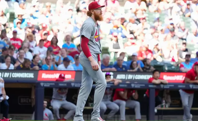 St. Louis Cardinals pitcher Dustin May reacts to giving up a no-hitter on a double hit by Milwaukee Brewers' Garrett Mitchell during the eighth inning of a baseball game Wednesday, May 27, 2026, in Milwaukee. (AP Photo/Kayla Wolf)